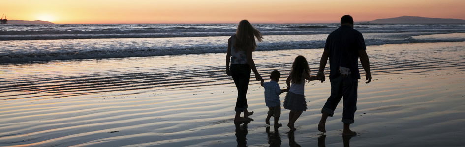 Family walking on beach