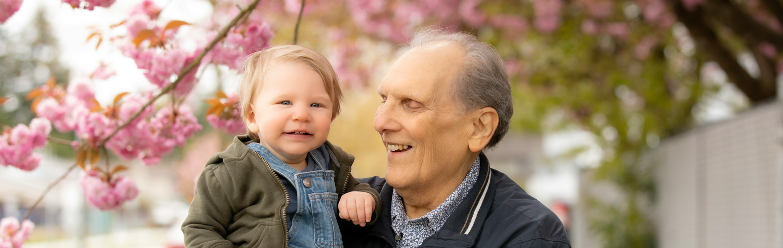 grandfather holding grandson