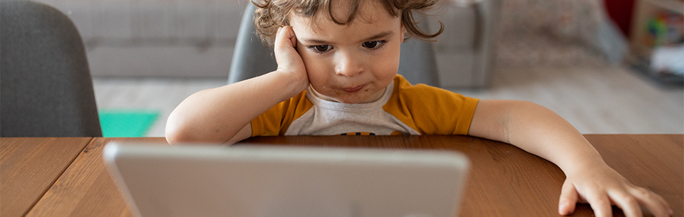 kid watching tablet