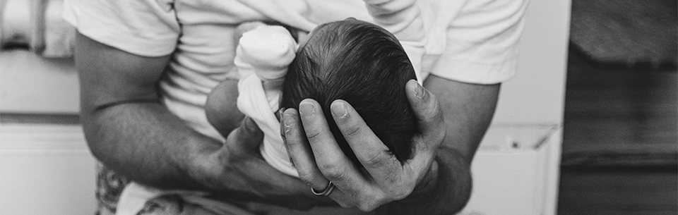Dad holding baby