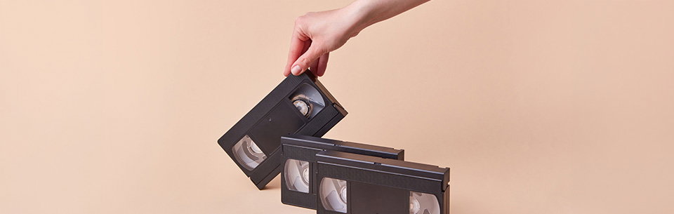 Hand Grabbing VHS Tape