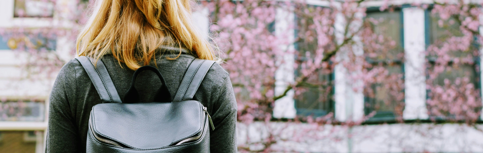 female university student walking outside