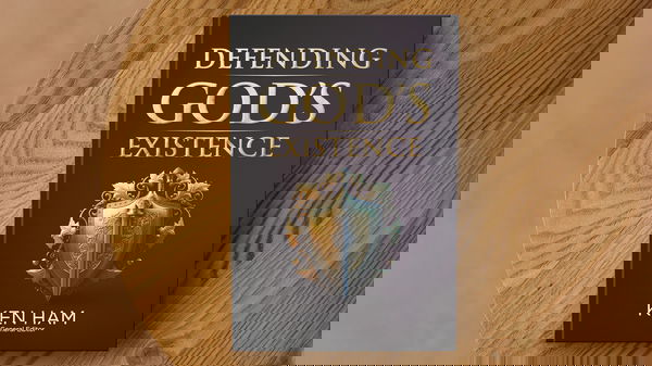 Defending God's Existence book on a table