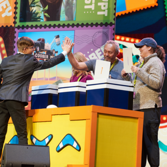 Kids playing team game with coolers